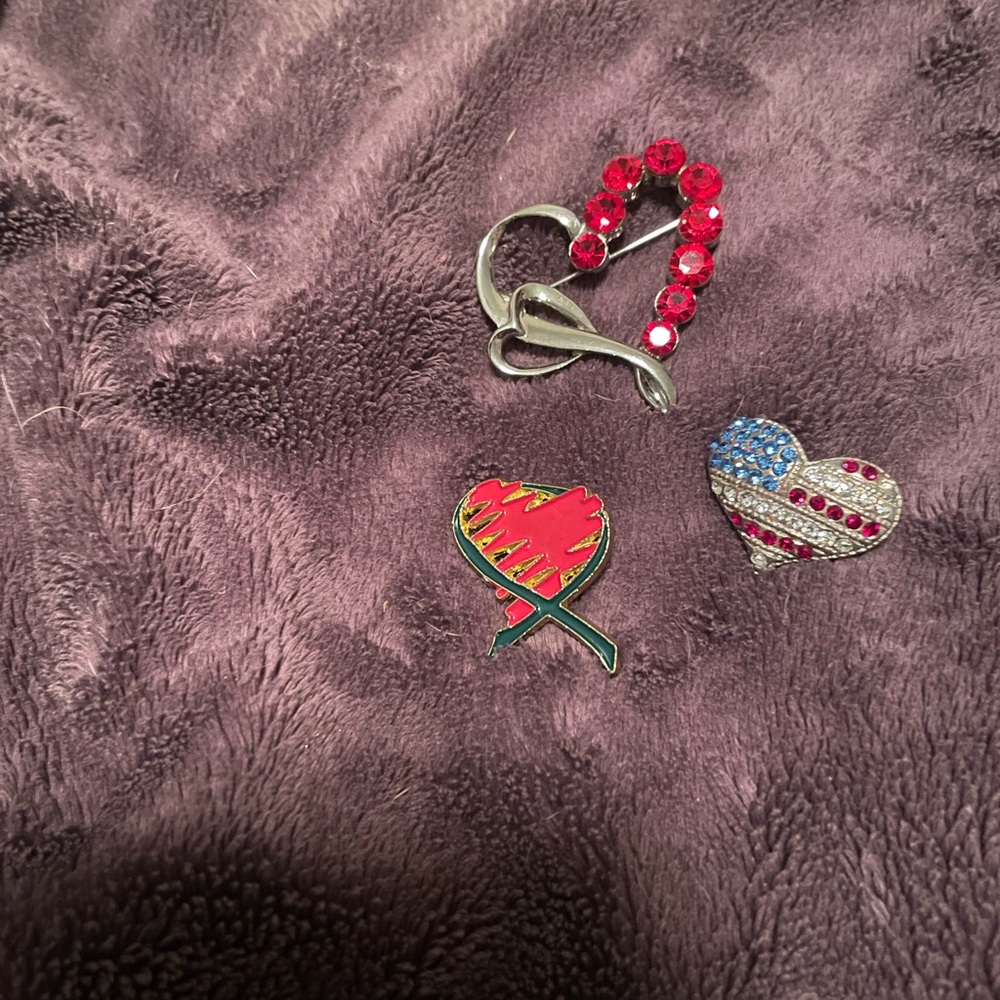 Several brooches five dollars each.